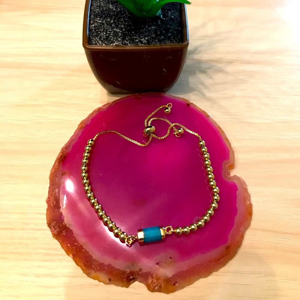One-of-a-kind hand made adjustable bracelet with blue Agate pendant.